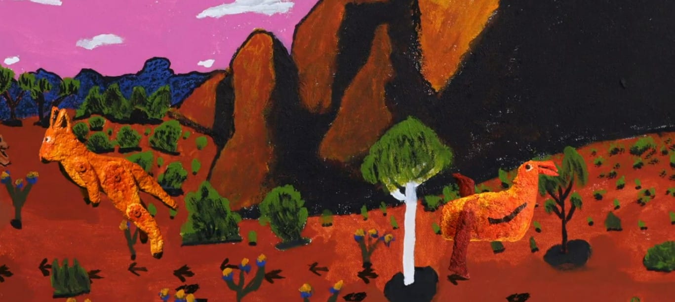 Colorful painting of two orange kangaroos in a vibrant desert landscape with red soil, green bushes, and rocky hills against a pink sky.
